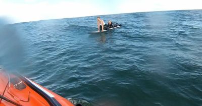 Scots paddleboarders filmed screaming for help as they clutch rescue vessel after drifting out to sea