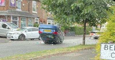 Car flips onto roof after crash in Manchester
