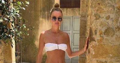 Amanda Holden shows off tan in white bikini while in Italy