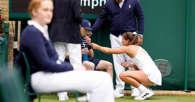 British number five Jodie Burrage gives ballboy Percy Pig sweets after he faints at Wimbledon