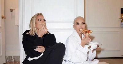 Kim and Khloe Kardashian accused by fans of 'pretending' to eat pizza in 'staged' pic