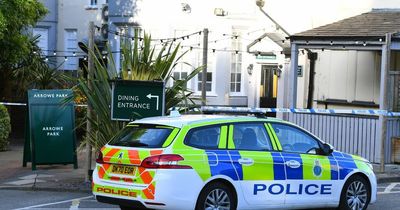 Drivers watch on as masked man with 'huge knife' runs into road outside pub