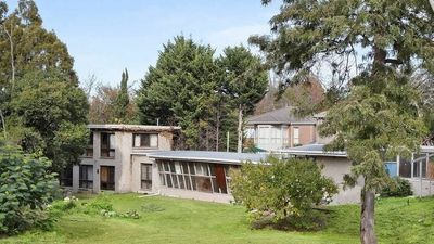Mid-century architect's former home auctioned after 30-year battle over heritage listing