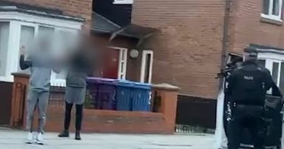 Police accused of 'racism' as officers point guns at two innocent black men with hands up