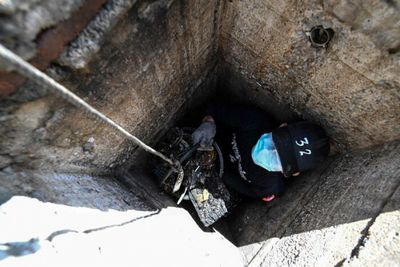 Prisoners clean Bangkok sewers after pandemic delay