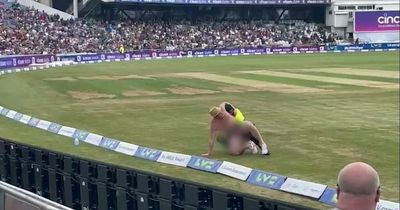 Streaker strips naked and runs onto field during England test match
