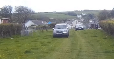 A councillor drove at a council contractor and trapped two children
