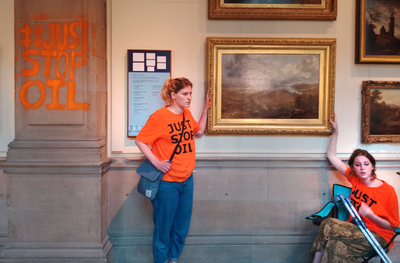 Climate protesters glue themselves to Glasgow gallery artwork