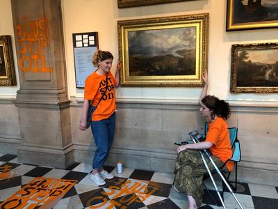 Climate protesters glue themselves to frame of artwork at Kelvingrove museum