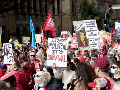 Striking teachers march to NSW parliament