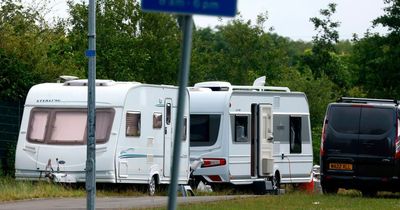 Pupils allowed to leave school early after travellers set up camp at the entrance