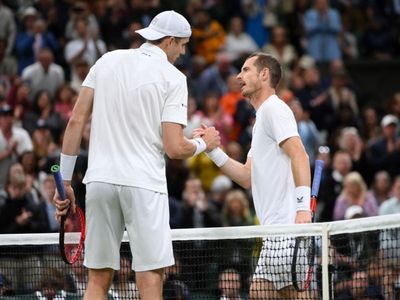 Andy Murray knocked out of Wimbledon by relentless John Isner