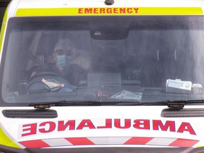 Woman struck by car while pushing pram