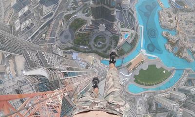 Briton poses as worker to dangle one-handed from crane 1,200ft above Dubai