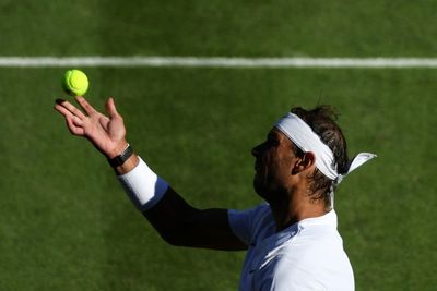 Nadal and Swiatek survive wobbles to progress at Wimbledon