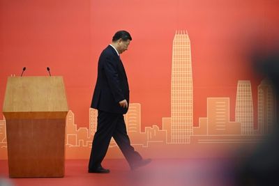 China's Xi presides over muted Hong Kong handover anniversary