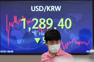Asian shares mostly lower after pessimistic 'tankan' survey