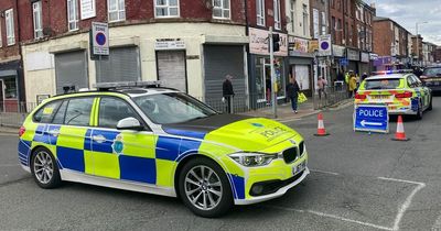 Men abandon car in middle of street after police chase