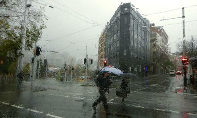 Driving rain batters NSW coast as authorities warn of flooding and landslips