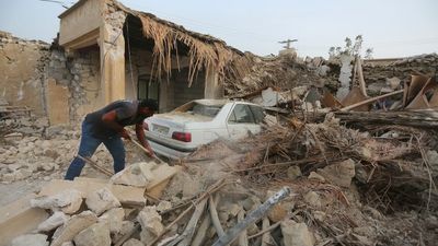 Iranians begin clearing debris following a deadly magnitude-6.1 earthquake