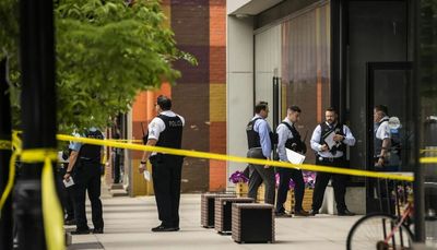 Chicago police officer among 25 shot in Chicago Friday; 2 killed and 7 wounded in separate mass shootings