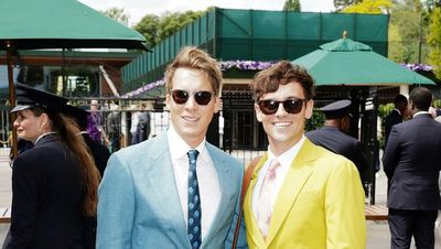 Tom Daley and Dustin Lance Black watch Wimbledon action from royal box