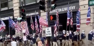 White supremacist group Patriot Front marches through downtown Boston with fascist flags