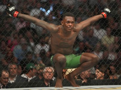 Israel Adesanya def. Jared Cannonier at UFC 276: Best photos