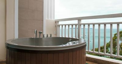 Neighbours call dad after scaffolders seen drinking beer in his hot tub