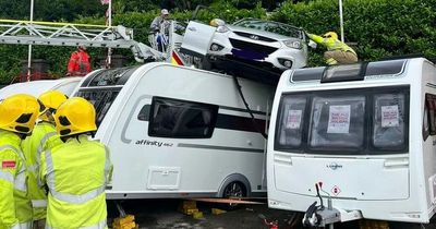 Driver lands car on top of caravans while trying to park