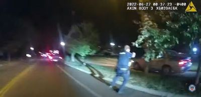 US officials urge calm after releasing video of police killing Black man