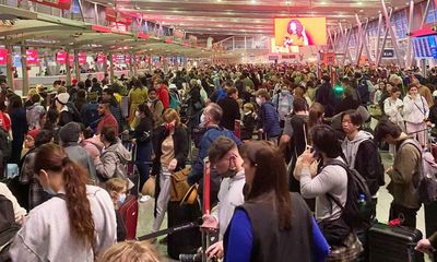 Travel chaos: extreme weather and school holidays cause long delays at Sydney airport