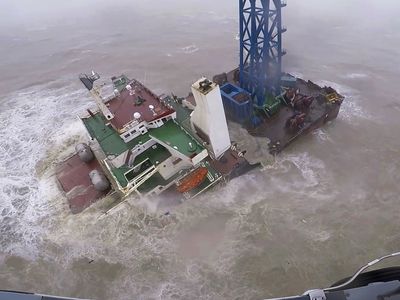 4 crew members are rescued after a floating crane sinks south of Hong Kong
