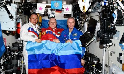 Russia releases photo of cosmonauts holding Luhansk flag on ISS