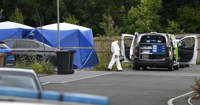 Police tents in place outside house with CSI at scene as murder probe continues