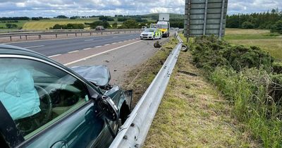 Car wrecked and motorway barrier smashed as Scots motorist rushed to hospital after crash