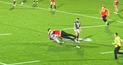 Rugby crowd goes wild for security guard's awesome side-step tackle on pitch invader in New Zealand