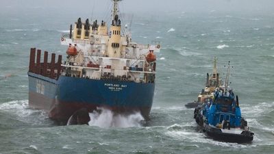 Bulk carrier stranded off Sydney drifts further north after tugboat cable snaps in rough seas