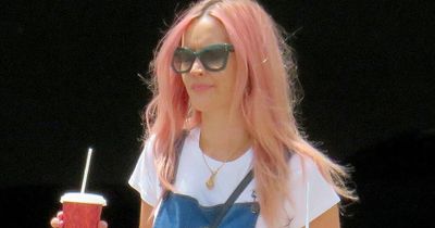 Laura Whitmore debuts bubblegum pink hair as she arrives in Mallorca for Love Island