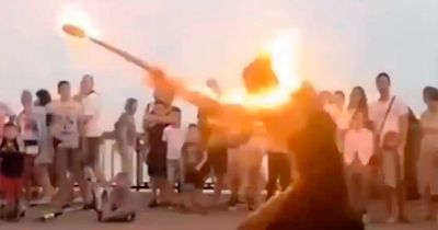 Fire dancer engulfed by flames after performance goes wrong in front of tourists
