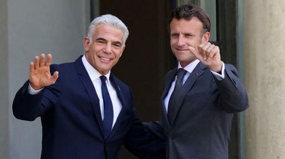 Israel’s Lapid Meets Macron in Paris on First Trip as PM