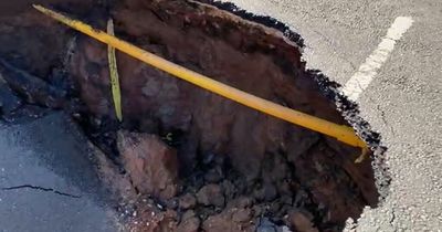 Pictures show inside 'scary' sinkhole which swallowed half a road