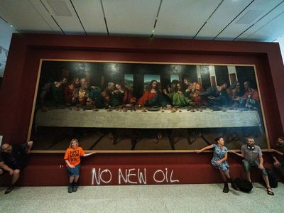 Climate protesters in England glued themselves to a copy of 'The Last Supper'