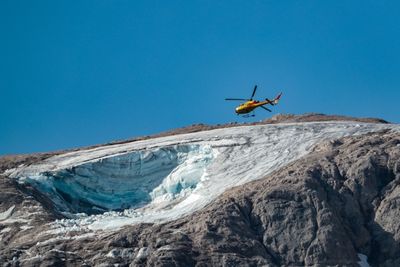Rescuers gather body parts after Italy glacier collapse