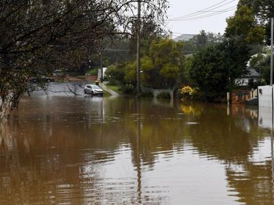 Pub underwater, villages cut off by floods