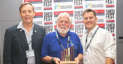 Dalbeattie Men's Shed celebrates after secretary wins top award