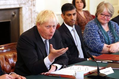 UK's Johnson vows to stay in office after top ministers quit