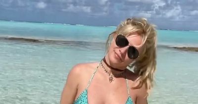 Britney Spears goes topless as she celebrates her honeymoon in 'tropical paradise'