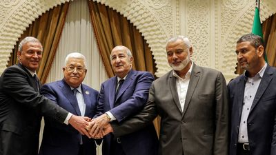 Rival Palestinian leaders shake hands for the first time in more than five years