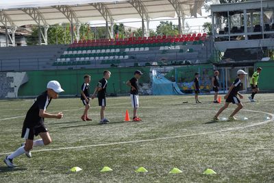 Ukrainian kids play soccer again in bombed-out stadium